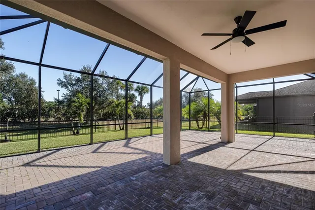 an aerial view of multiple houses with a yard