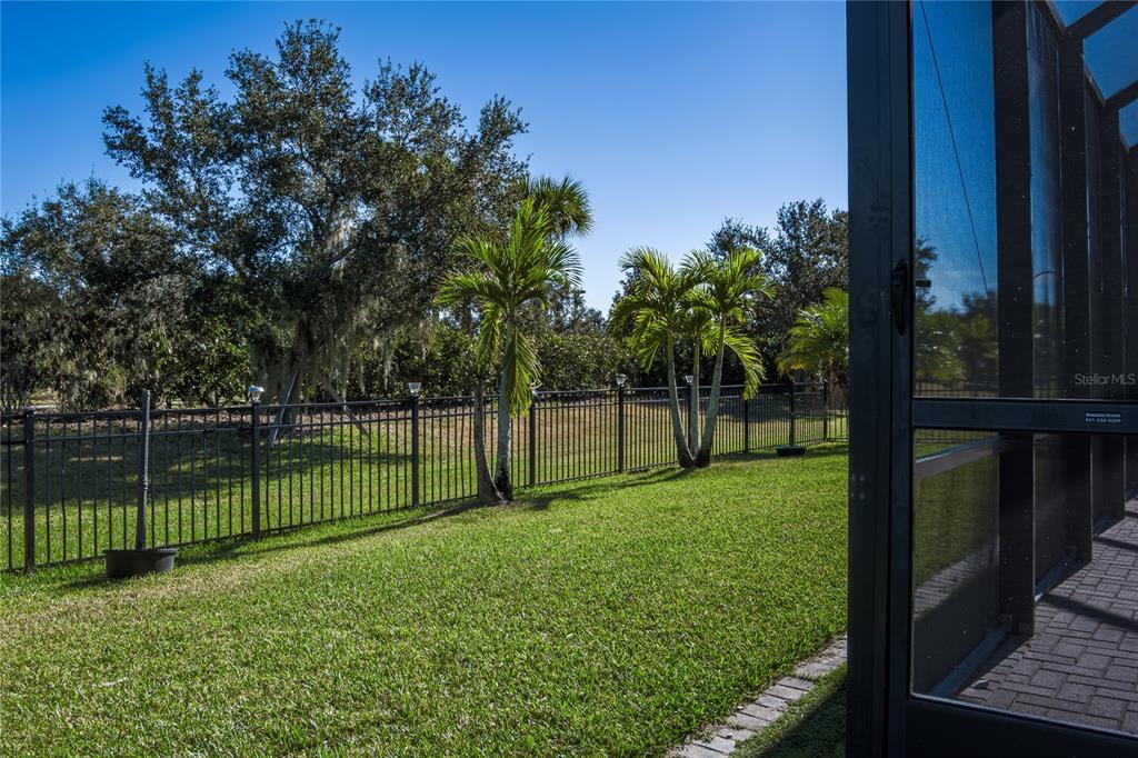 6026 100th Avenue East Parrish, FL 34219 - Photo 32 of 51 a view of a backyard with a garden