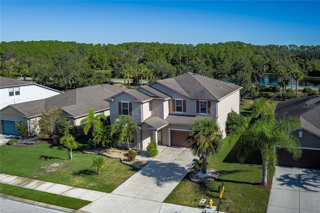 6026 100th Avenue East Parrish, FL 34219 - Photo 33 of 51 a front view of a house with a yard
