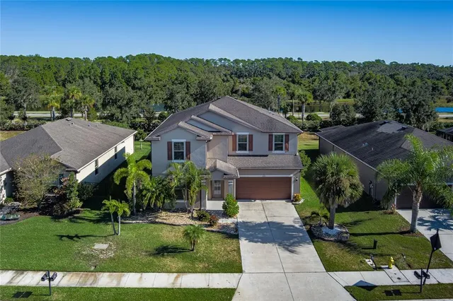 a living room with furniture pool table and a window
