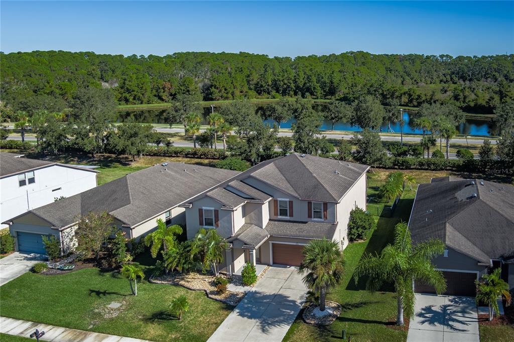 6026 100th Avenue East Parrish, FL 34219 - Photo 36 of 51 an aerial view of multiple houses with a yard