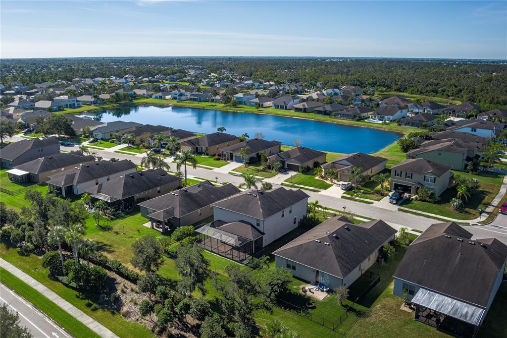 6026 100th Avenue East Parrish, FL 34219 - Photo 38 of 51 an aerial view of a houses with a lake view