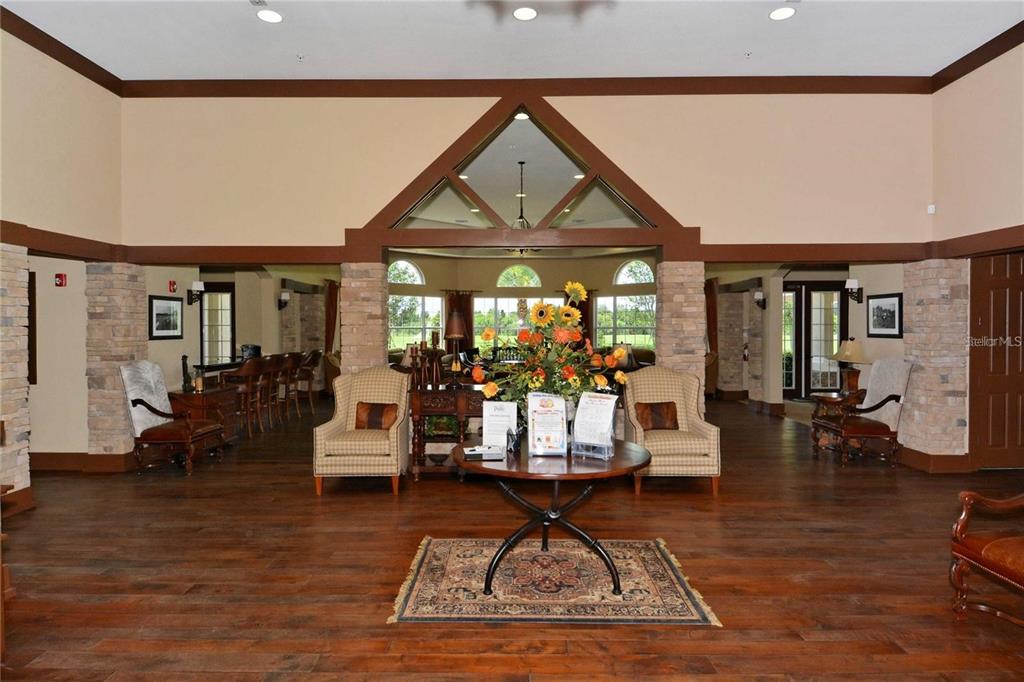 6026 100th Avenue East Parrish, FL 34219 - Photo 41 of 51 a living room with furniture a rug and a large window
