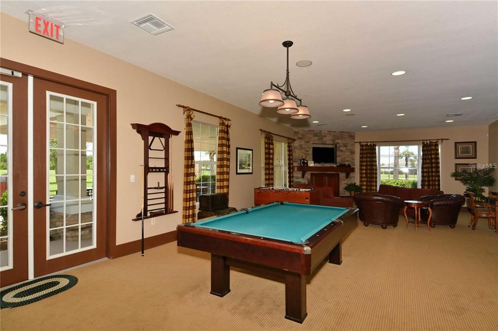 6026 100th Avenue East Parrish, FL 34219 - Photo 43 of 51 a living room with furniture pool table and a window