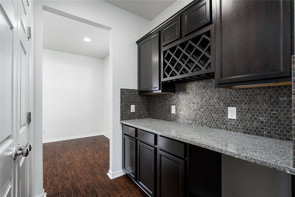 6026 100th Avenue East Parrish, FL 34219 - Photo 7 of 51 a kitchen with a sink and a stove