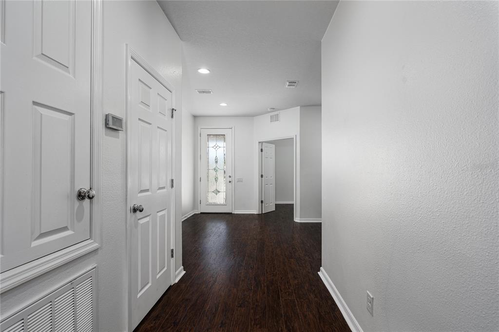 6026 100th Avenue East Parrish, FL 34219 - Photo 10 of 51 a view of a hallway with wooden floor