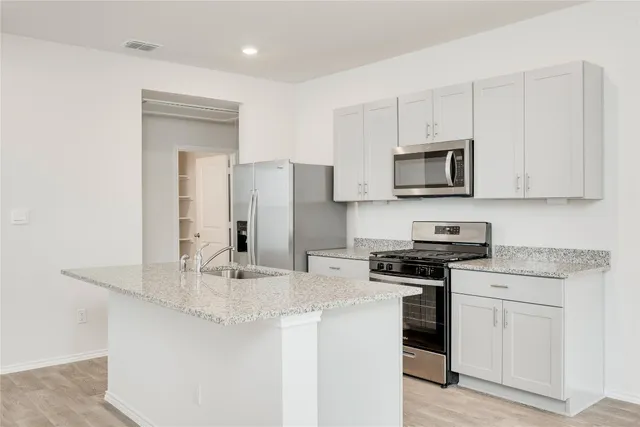 a view of a house with backyard and porch