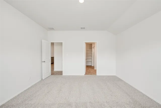 a bathroom with a sink toilet vanity and shower