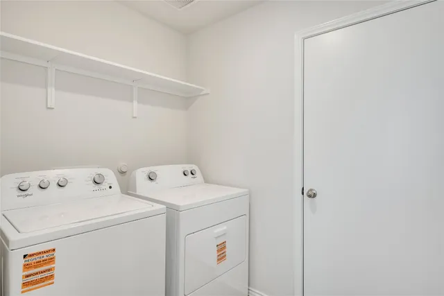 an empty room with windows and entrance