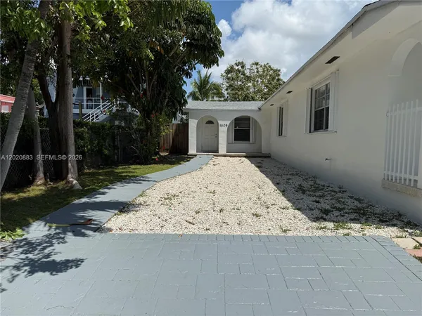 a house with trees in front of it