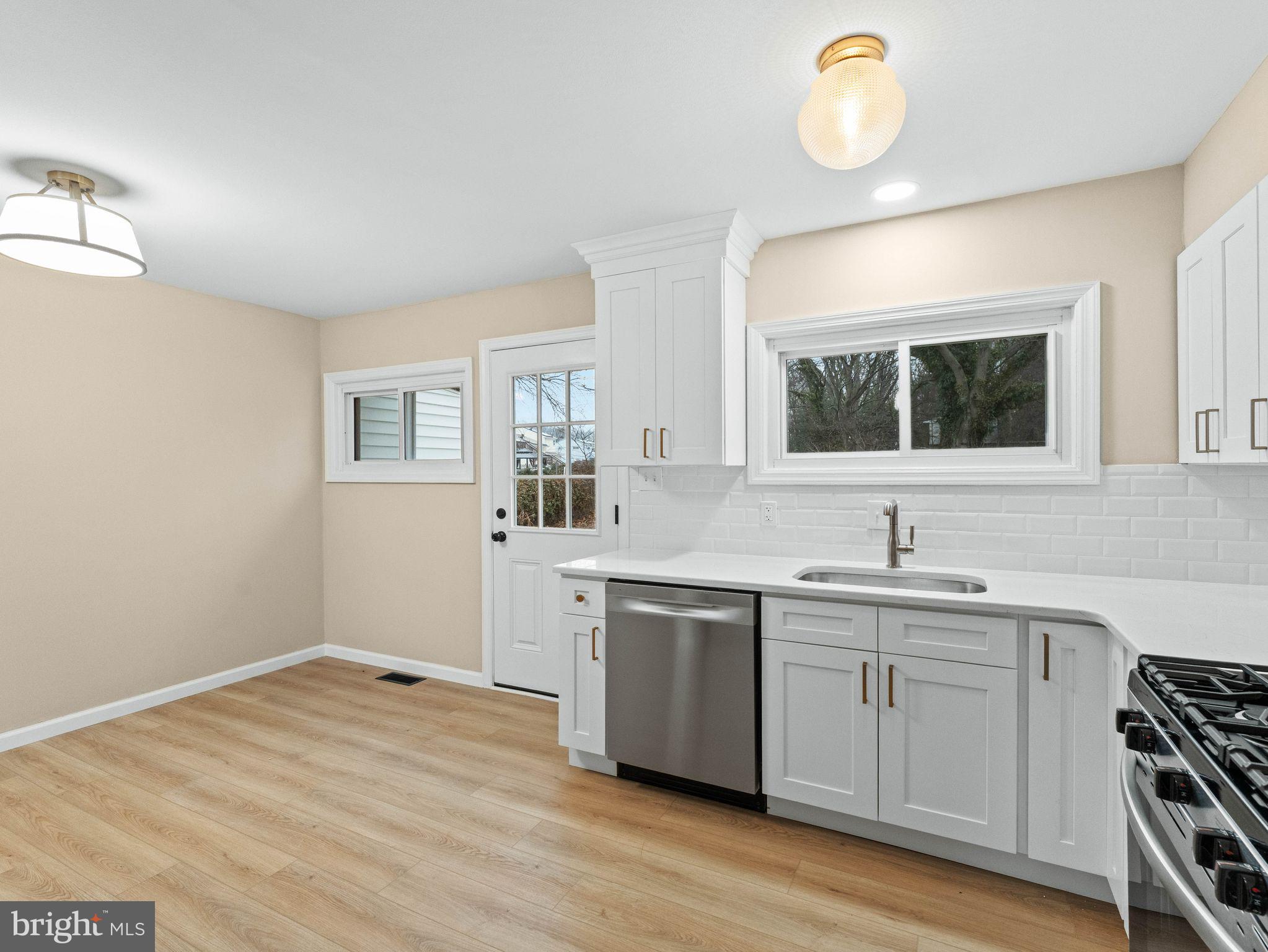 148 Lincoln Road Wenonah, NJ 08090 - Photo 12 of 40 a kitchen with a sink cabinets and wooden floor