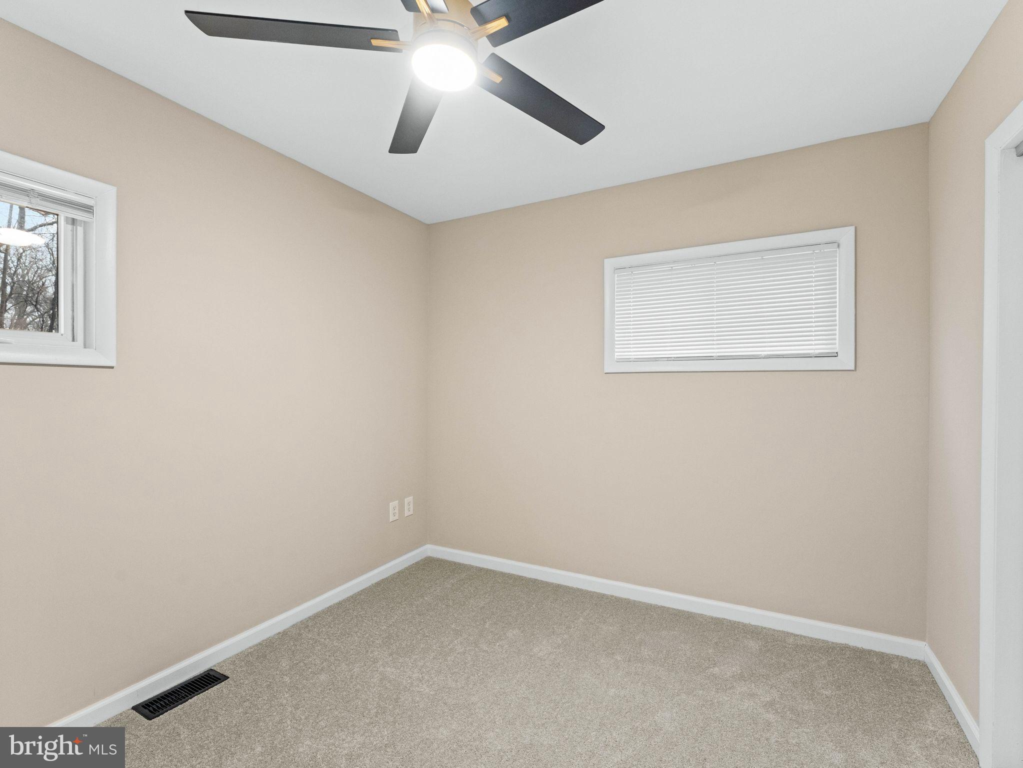 148 Lincoln Road Wenonah, NJ 08090 - Photo 16 of 40 an empty room with a window and a fan
