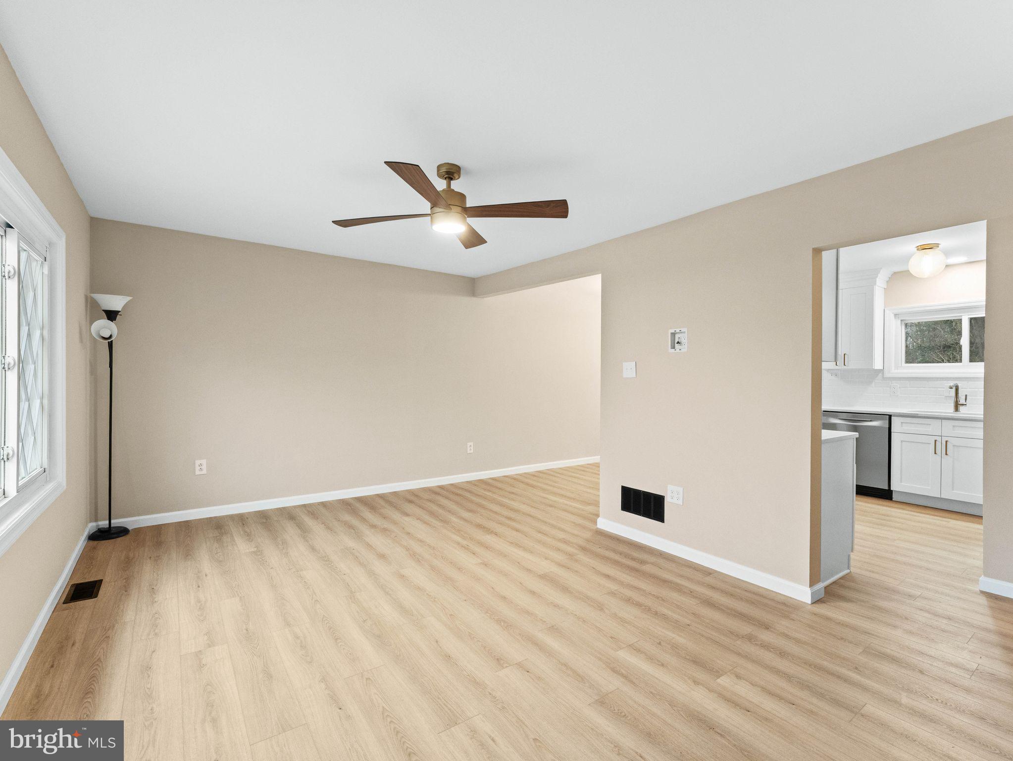148 Lincoln Road Wenonah, NJ 08090 - Photo 5 of 40 an empty room with wooden floor and windows