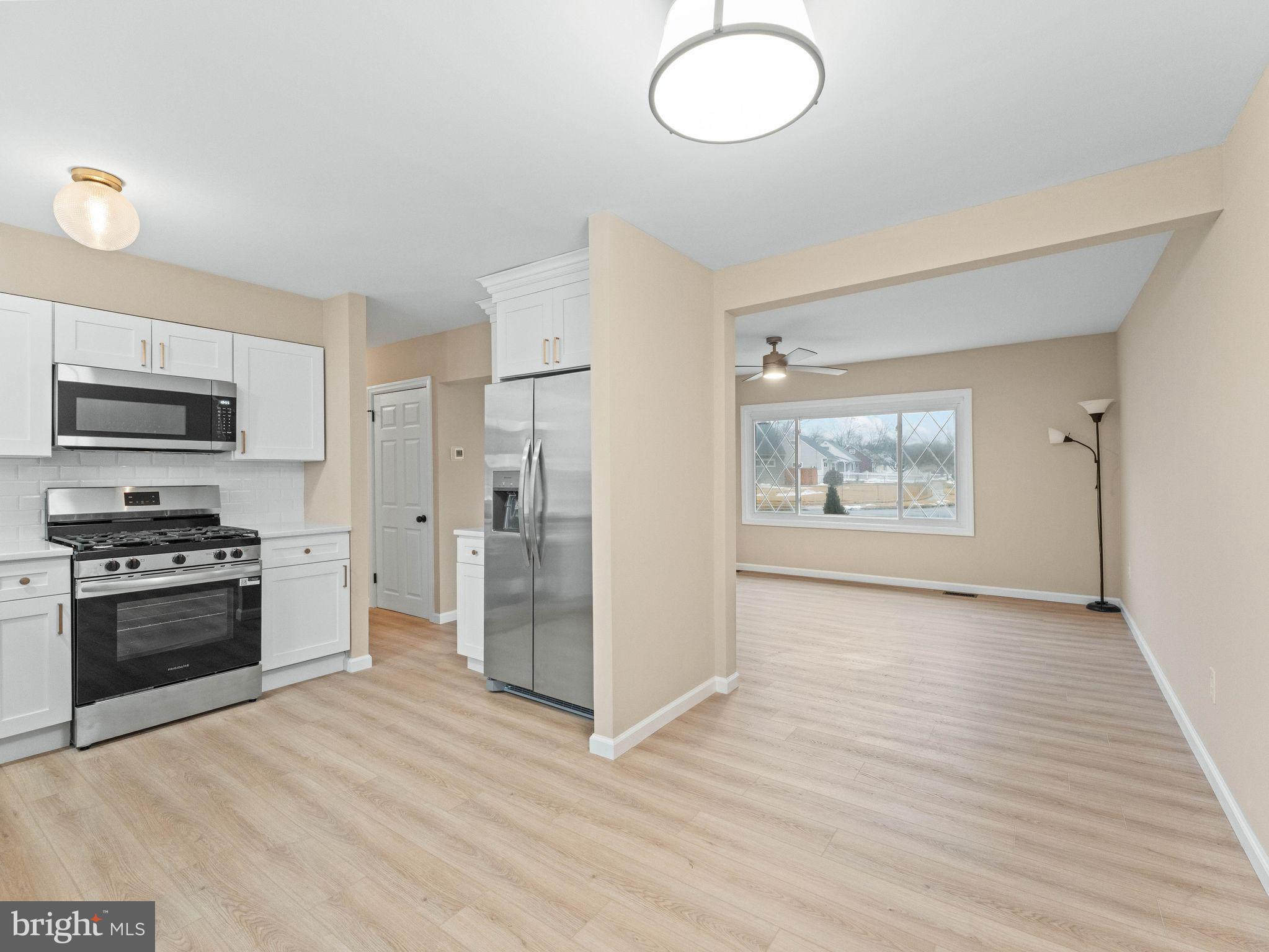 148 Lincoln Road Wenonah, NJ 08090 - Photo 9 of 40 a view of a kitchen with a sink a refrigerator and window