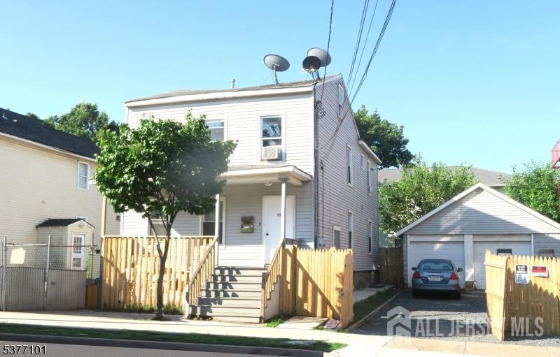 114 Seaman Street New Brunswick, NJ 08901 - Photo 1 of 1 a front view of a house with a yard