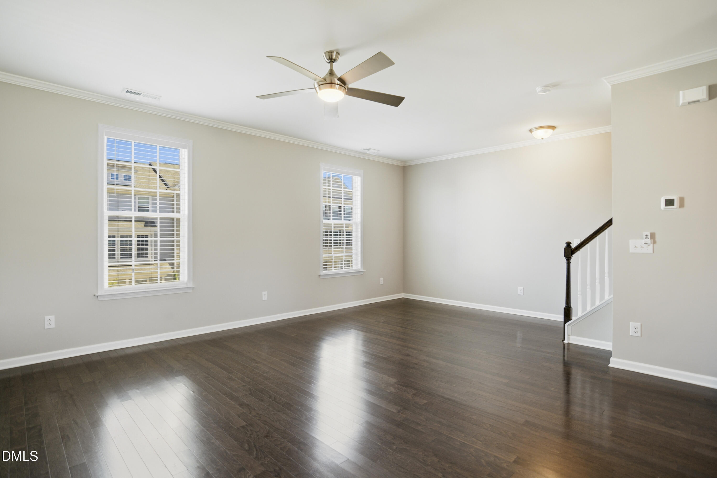 5916 Giddings Street Raleigh, NC 27616 - Photo 4 of 49 a view of an empty room with wooden floor and a window