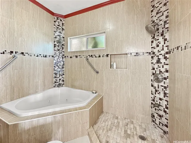 a bathroom with shower and bathtub