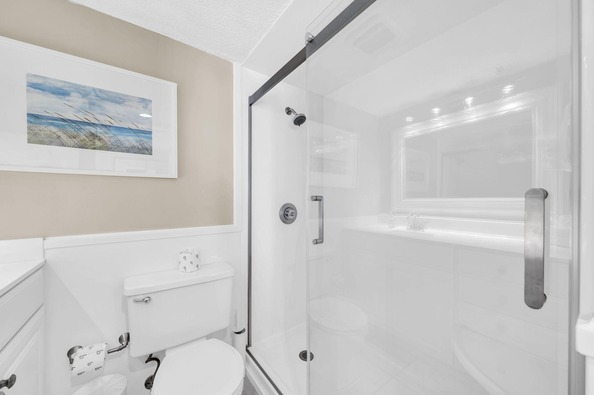 676 Santa Rosa Boulevard, Unit 5F Fort Walton Beach, FL 32548 - Photo 16 of 34 a bathroom with a granite countertop sink a toilet and shower