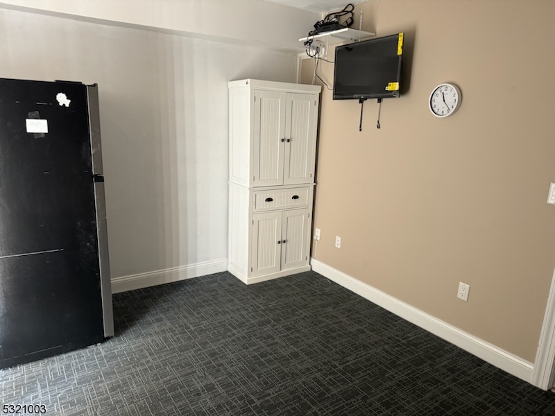 51 Main Street Succasunna, NJ 07876 - Photo 13 of 33 an empty room with closet and mirror