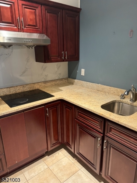 51 Main Street Succasunna, NJ 07876 - Photo 16 of 33 a kitchen with a sink and cabinets