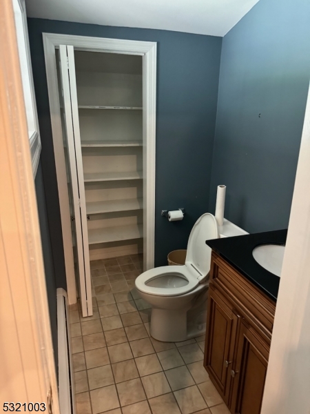 51 Main Street Succasunna, NJ 07876 - Photo 18 of 33 a bathroom with a toilet and a sink