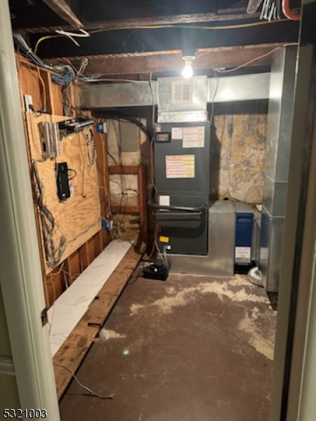 51 Main Street Succasunna, NJ 07876 - Photo 31 of 33 a view of water heater room with wooden floor