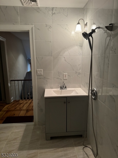 51 Main Street Succasunna, NJ 07876 - Photo 33 of 33 a bathroom with a sink and mirror