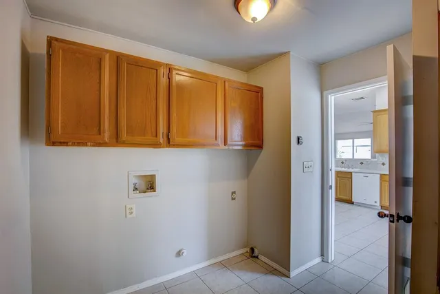 a window in an empty room with wooden floor