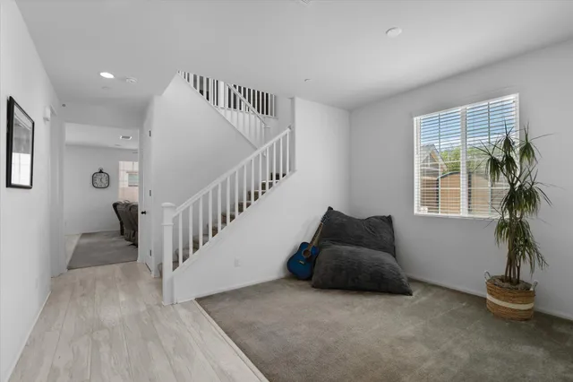 a kitchen with stainless steel appliances granite countertop a stove refrigerator sink and microwave