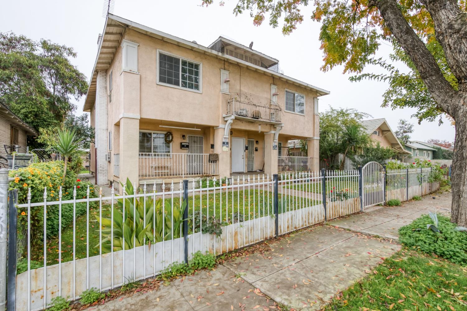 450 North Effie Street Fresno, CA 93701 - Photo 2 of 21 a view of a house with a small yard and plants