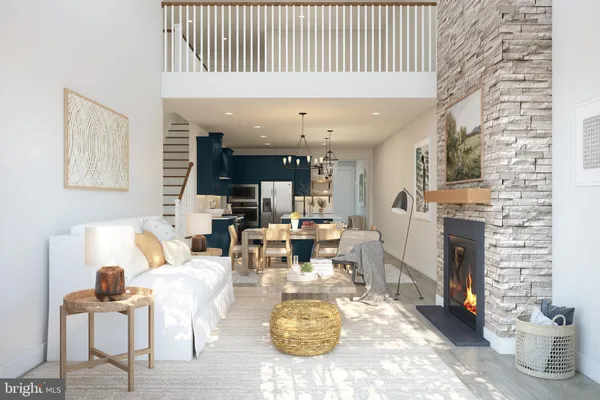 a living room with fireplace furniture and a potted plant