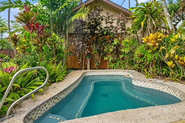 a view of a swimming pool with a yard