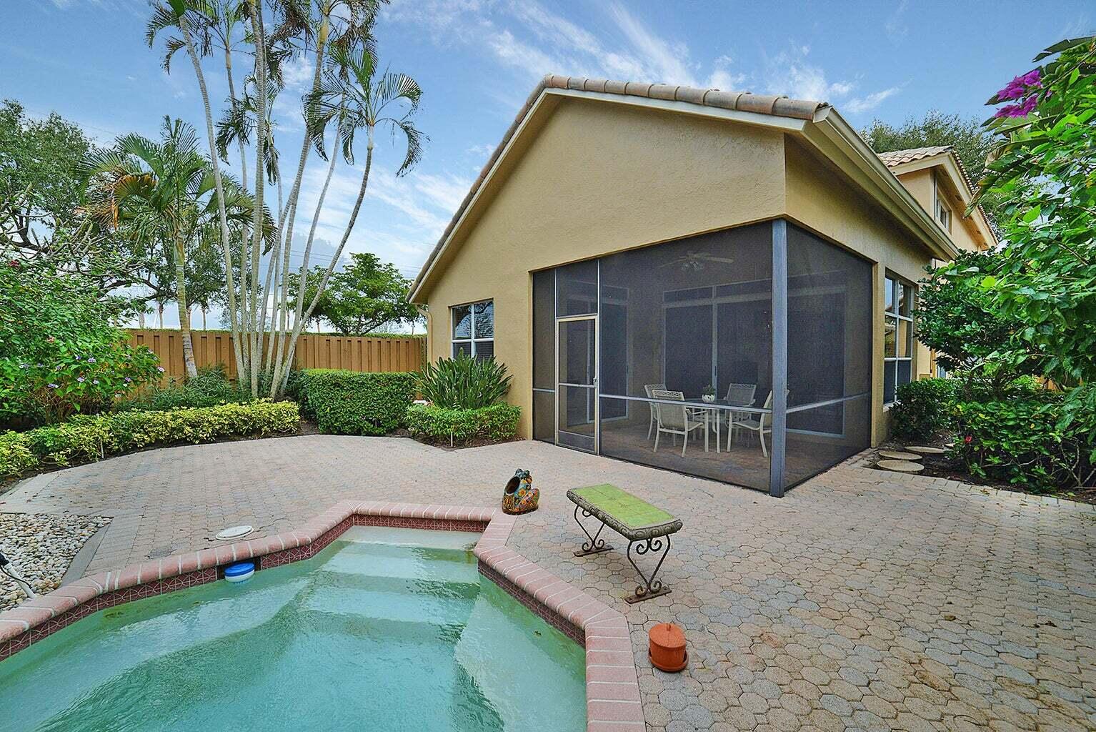6695 Northwest 25th Court Boca Raton, FL 33496 - Photo 24 of 40 a house with yard in front of it