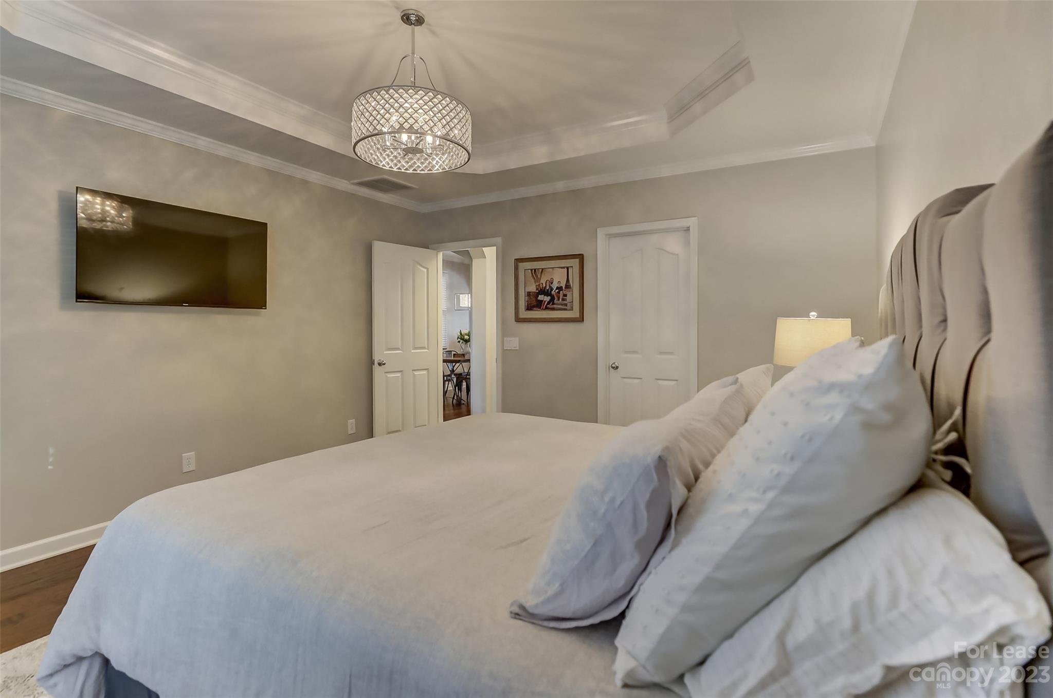 1033 Market Street Fort Mill, SC 29708 - Photo 22 of 48 a spacious bedroom with a bed and a flat screen tv