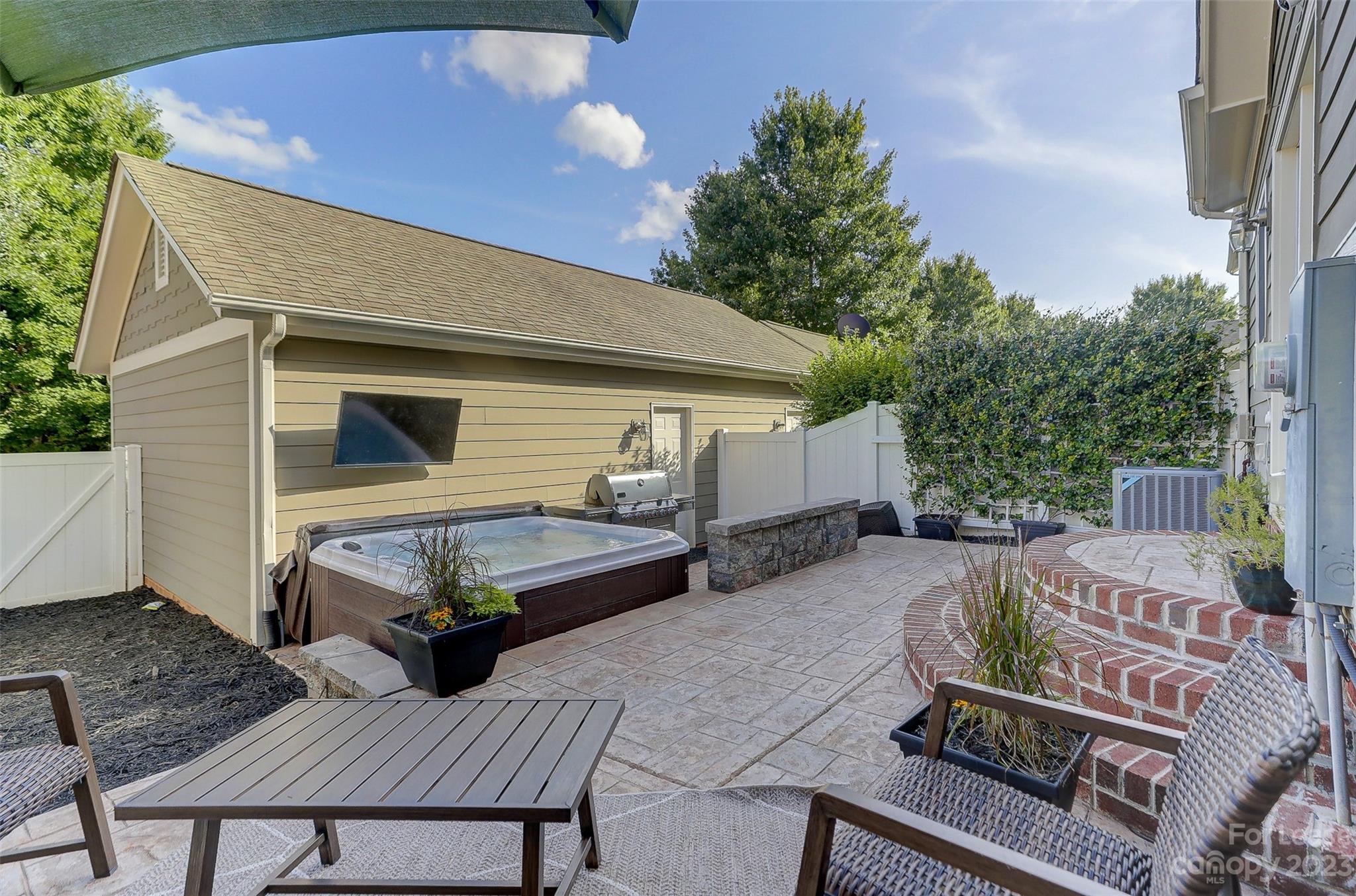 1033 Market Street Fort Mill, SC 29708 - Photo 36 of 48 a view of a patio with table and chairs with wooden floor and fence