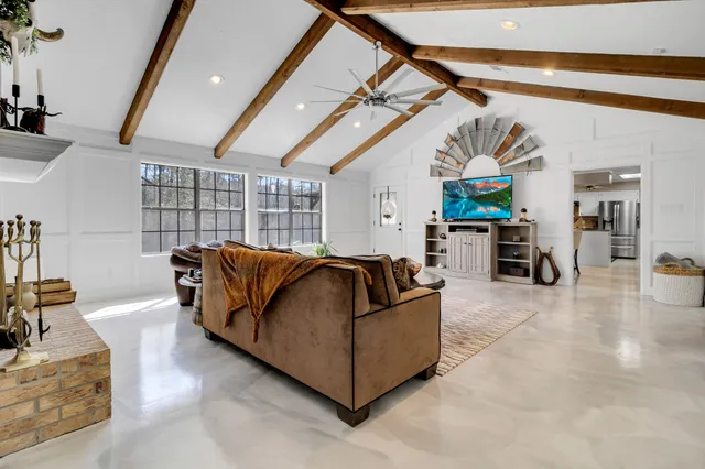 a kitchen with refrigerator and cabinets
