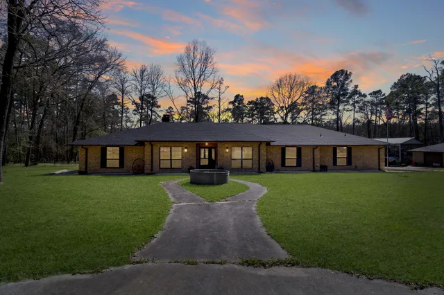 a view of a big yard of front a house