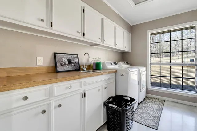 a view of a patio with table and chairs