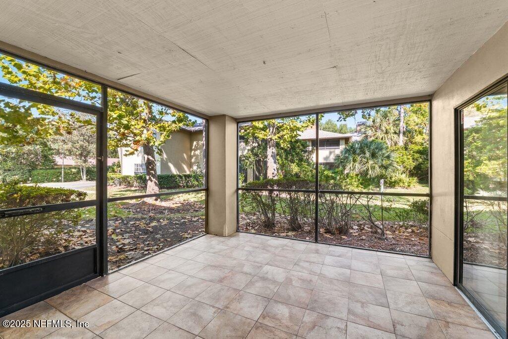 10150 Belle Rive Boulevard, Unit 303 Jacksonville, FL 32256 - Photo 14 of 23 a view of an outdoor space with a large window