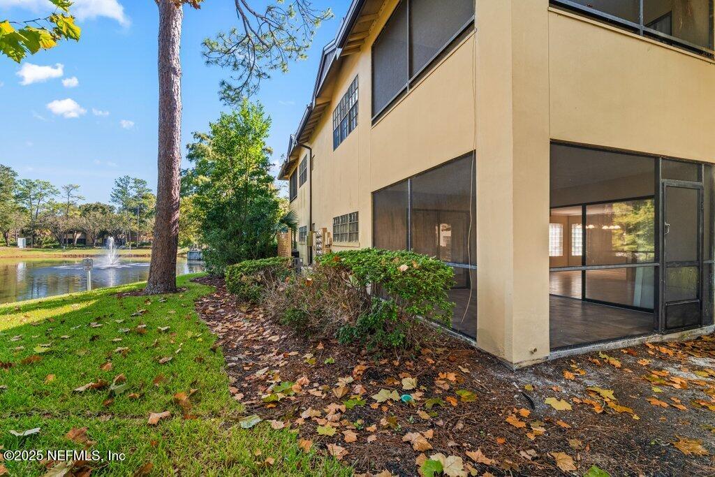 10150 Belle Rive Boulevard, Unit 303 Jacksonville, FL 32256 - Photo 16 of 23 a view of backyard with patio