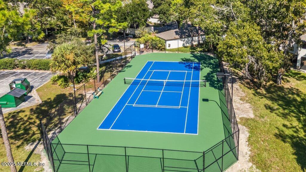 10150 Belle Rive Boulevard, Unit 303 Jacksonville, FL 32256 - Photo 22 of 23 a view of a yard with chairs