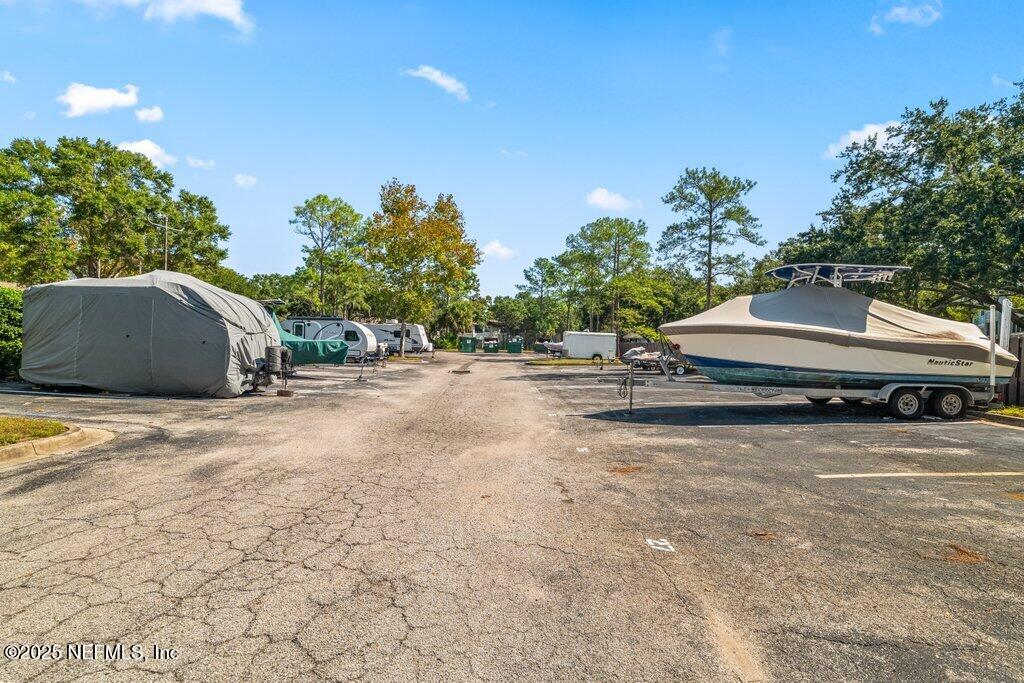 10150 Belle Rive Boulevard, Unit 303 Jacksonville, FL 32256 - Photo 23 of 23 a view of a street with some trees