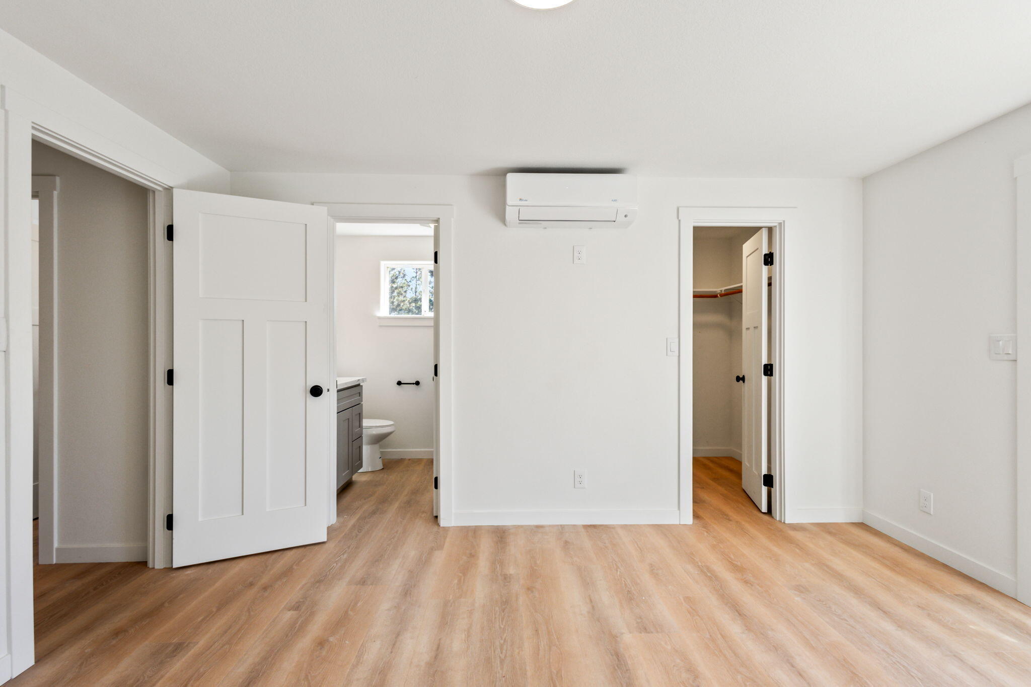 19126 Pumice Butte Road Bend, OR 97702 - Photo 24 of 40 a view of a room with wooden floor and a bathroom