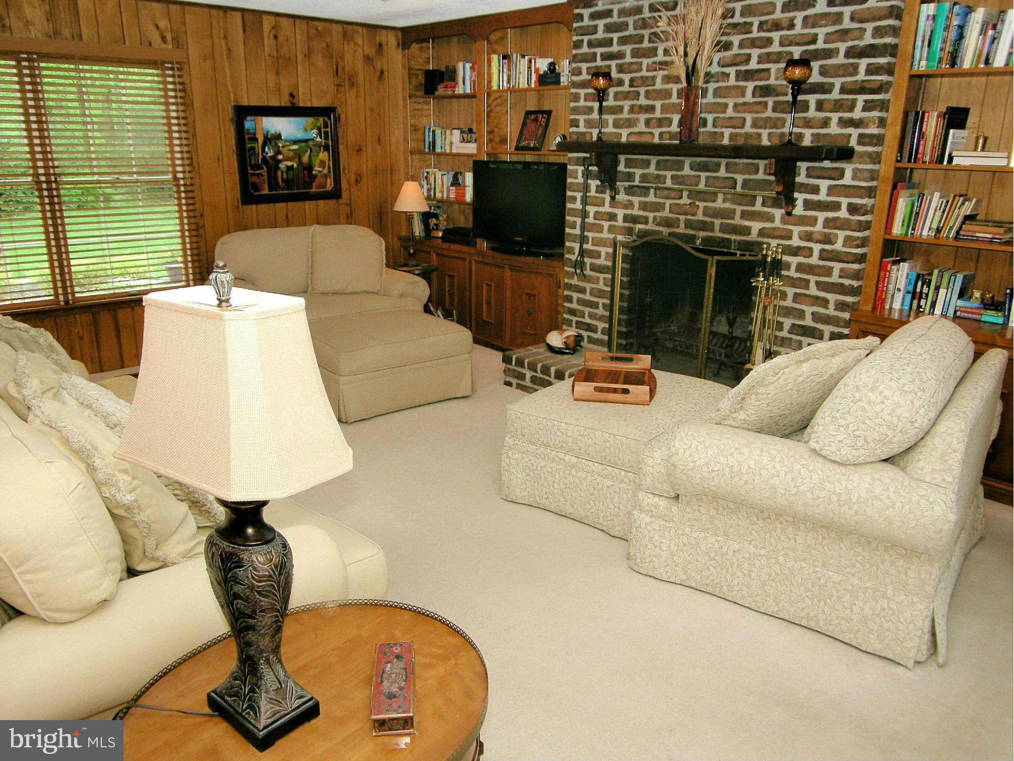 13909 Foxland Road Phoenix, MD 21131 - Photo 9 of 27 a living room with furniture and a fireplace