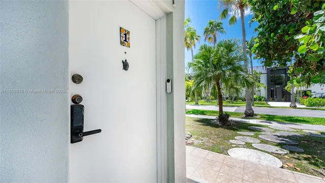 a view of a swimming pool with some potted plants