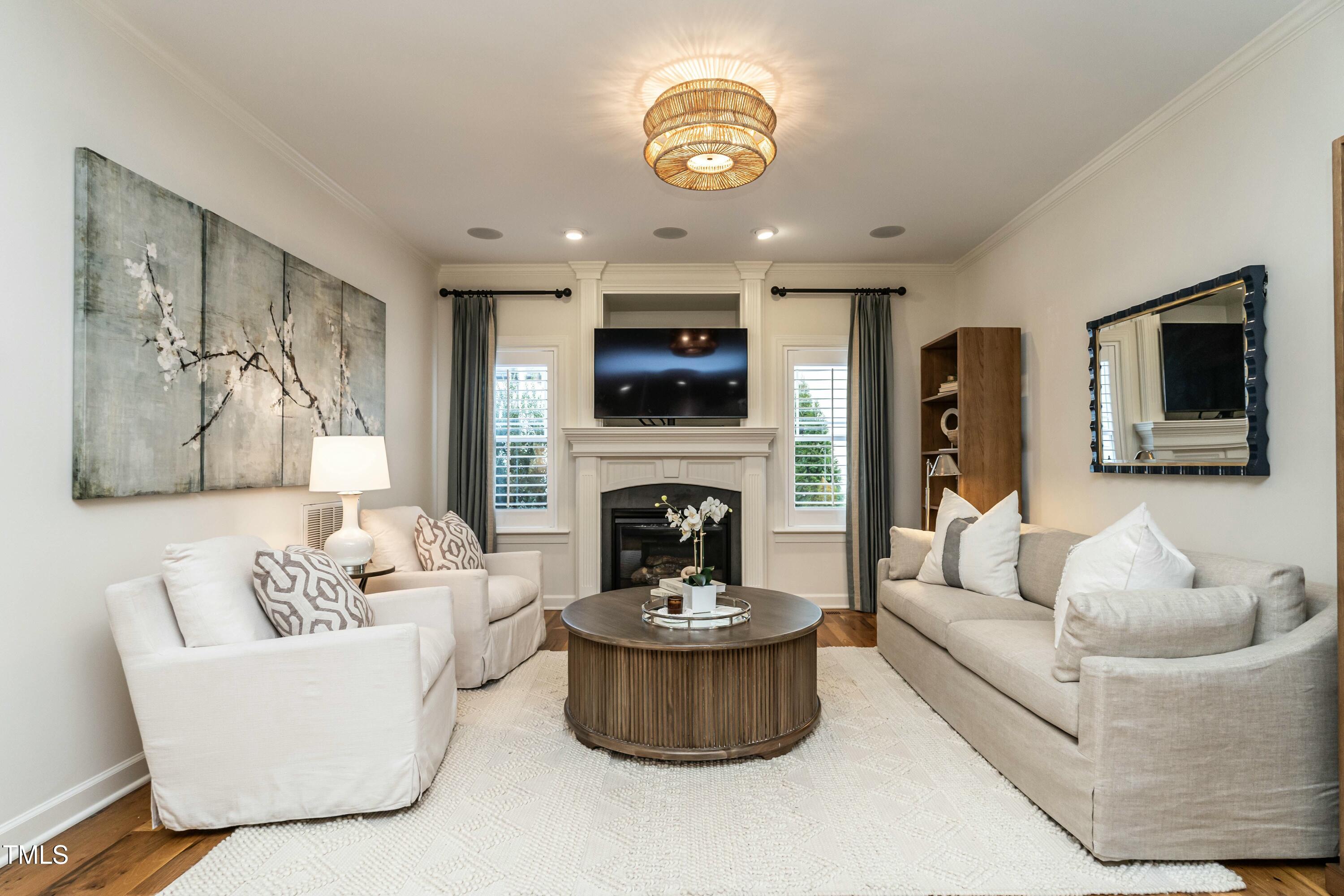 708 Kimbrough Street Raleigh, NC 27608 - Photo 12 of 36 a living room with furniture and a fireplace