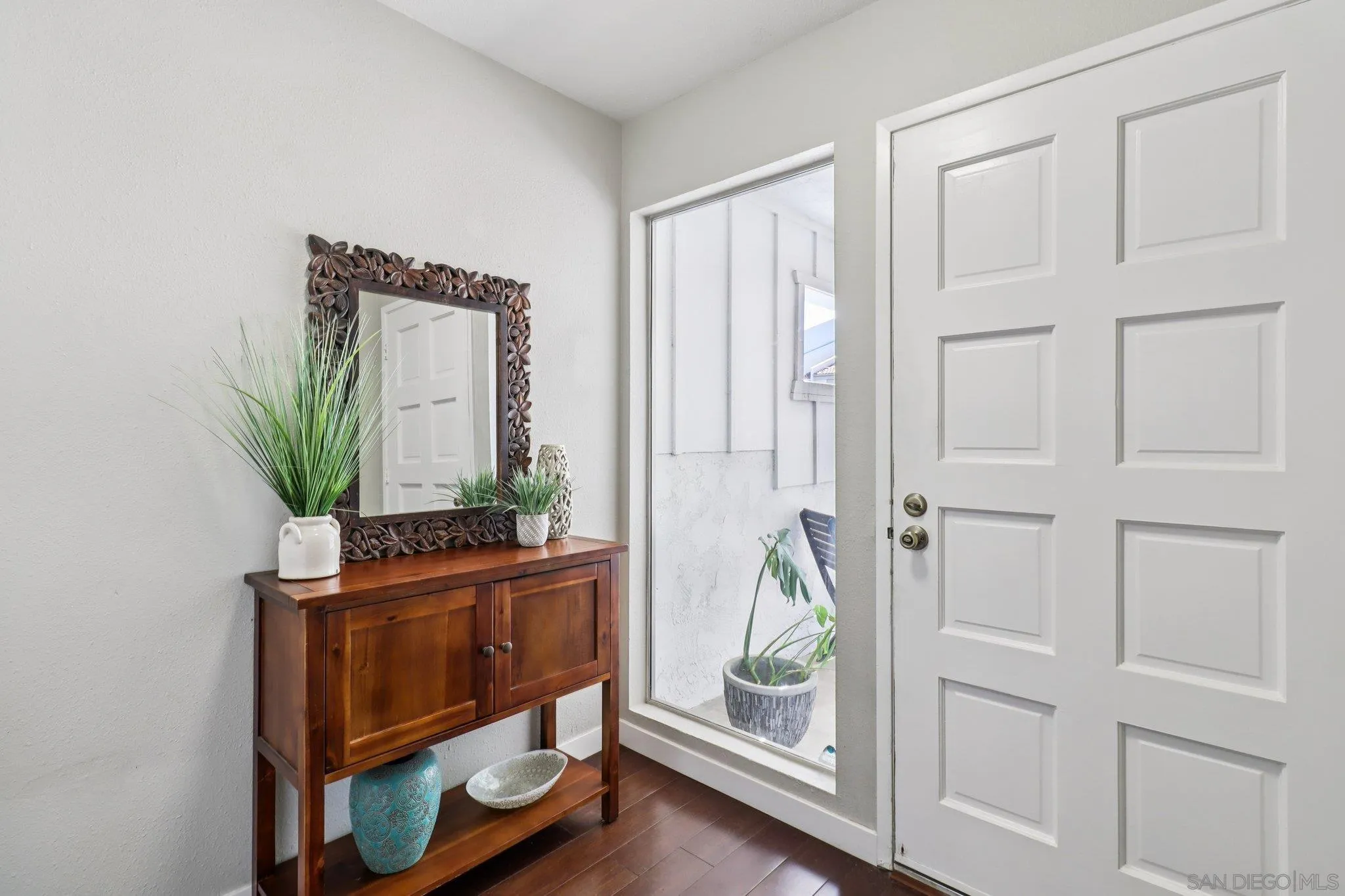 6329 Caminito Estrellado San Diego, CA 92120 - Photo 19 of 61 a living room with furniture and a mirror