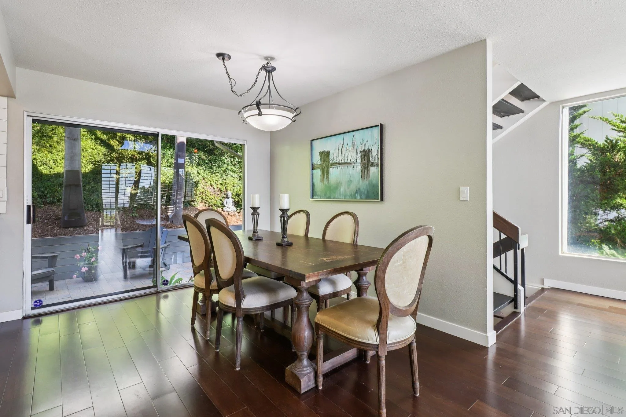 6329 Caminito Estrellado San Diego, CA 92120 - Photo 22 of 61 a view of a dining room with furniture window and wooden floor