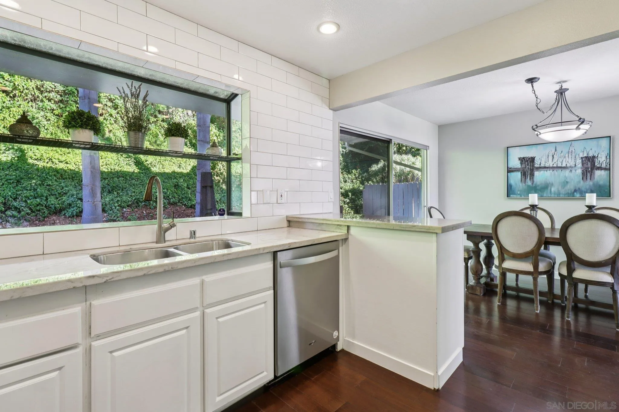 6329 Caminito Estrellado San Diego, CA 92120 - Photo 27 of 61 a kitchen with a sink stove and cabinets