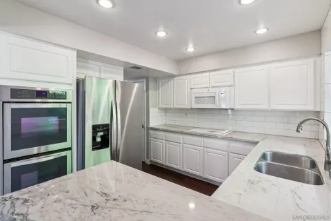 a bedroom with bed and window